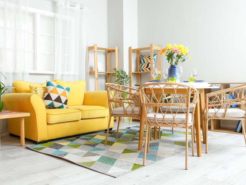 yellow couch on a patterned area rug from The Carpet Store in Oklahoma City, OK
