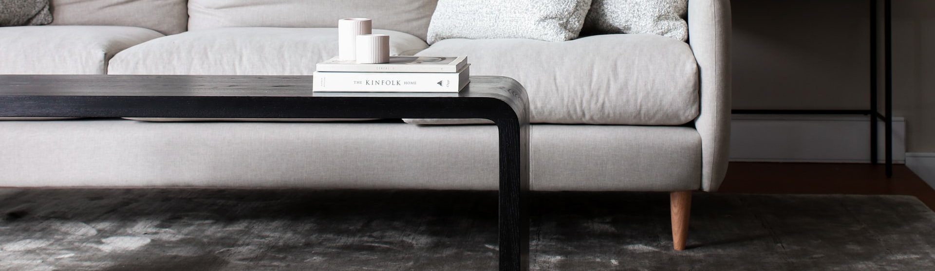 white couch and black coffee table on a brown hardwood floor from The Carpet Store in Oklahoma City, OK